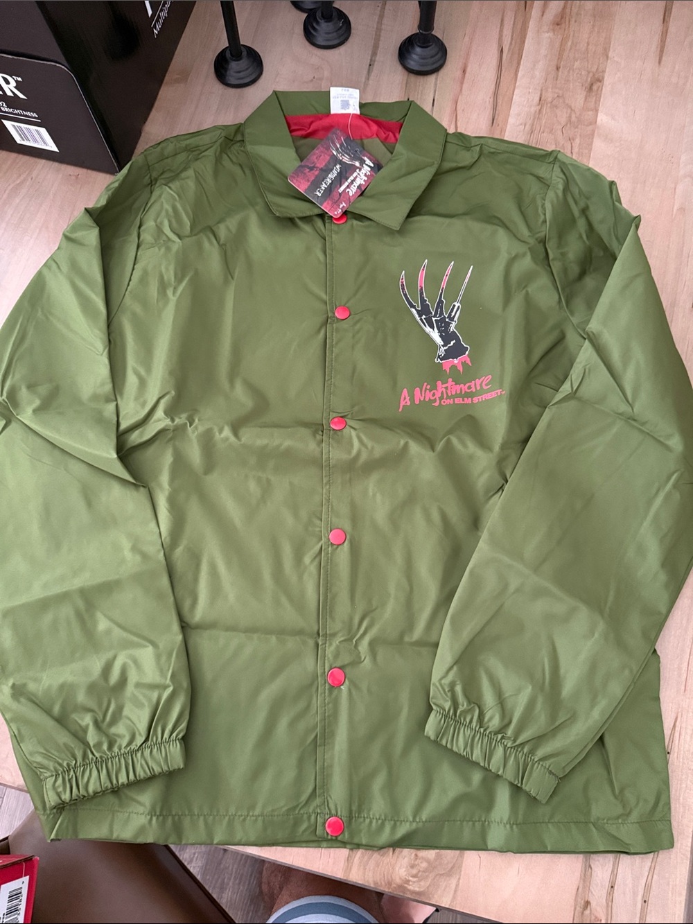 A Nightmare On Elm Street Olive Windbreaker Jacket with Red Accents